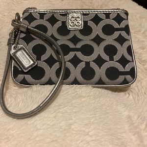 Black and silver Coach wristlet